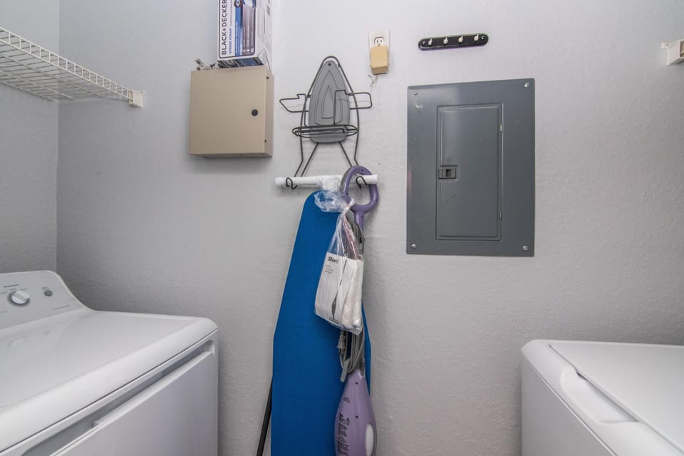 Interior Utility Room off of Kitchen w/ a full size washer and dryer