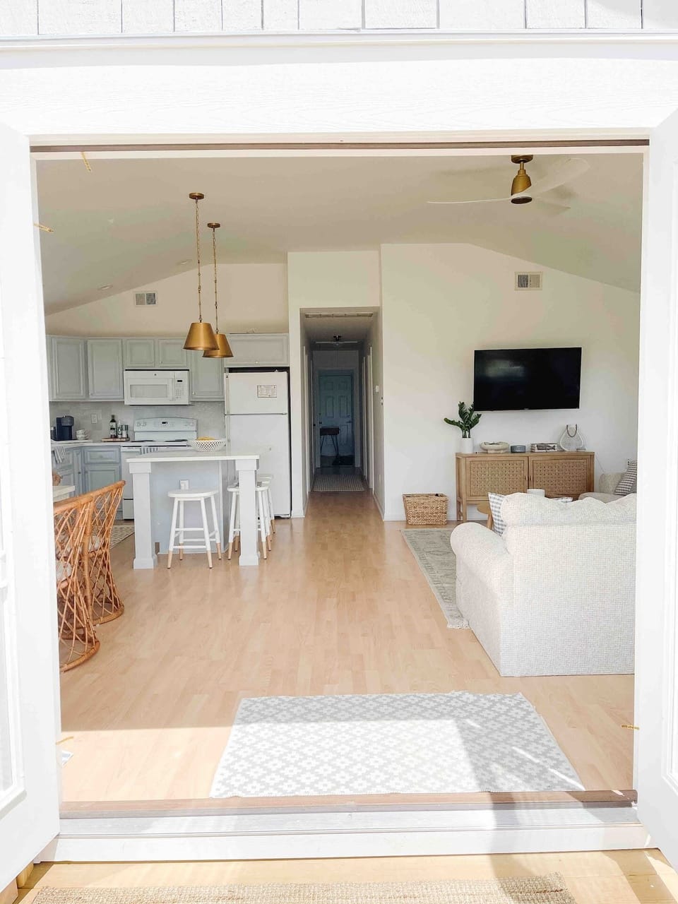 View from the front doors looking into the kitchen and family room. 