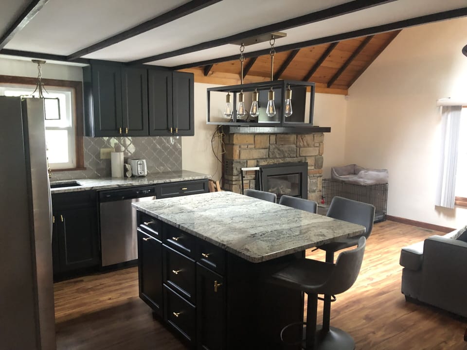 Kitchen with 4 stools plus a table that can fit another 4