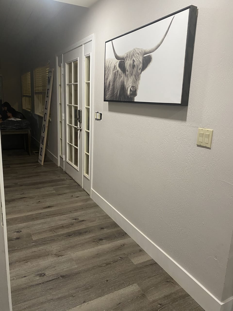 Main hallway with full size washer and dryer.