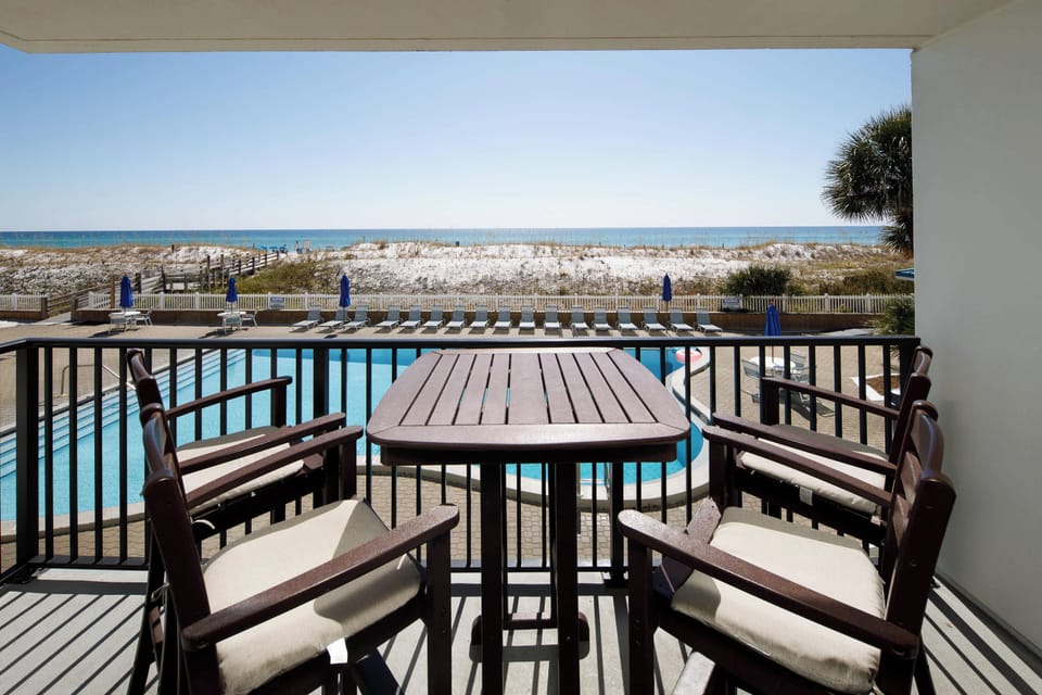 Private balcony with beach and pool views