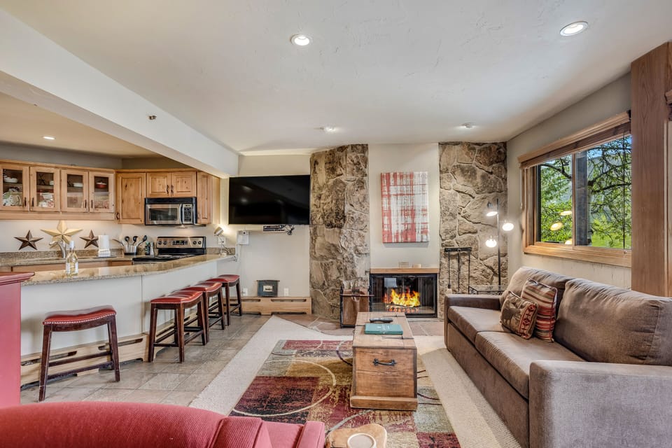 Living room with wood-burning fireplace