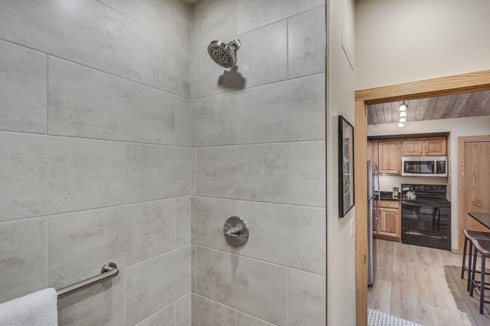 Full bathroom with recently remodeled walk-in shower