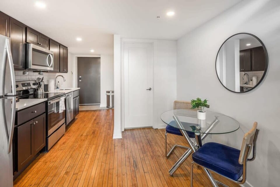Enjoy home-cooked or the neighborhood's best takeout in this lovely kitchen with stainless steel appliances, a microwave, and a full-sized refrigerator