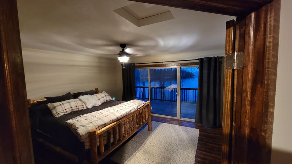 Master bedroom with 12' patio door overlooking lake.  Door directly into bath.