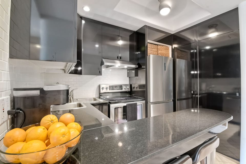 Stainless steel appliances stand at your ready to prepare an amazing meal.