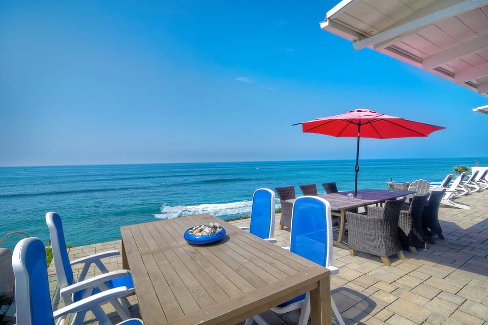 Lounge chairs, adirondack chairs, and dining seating for ten people.