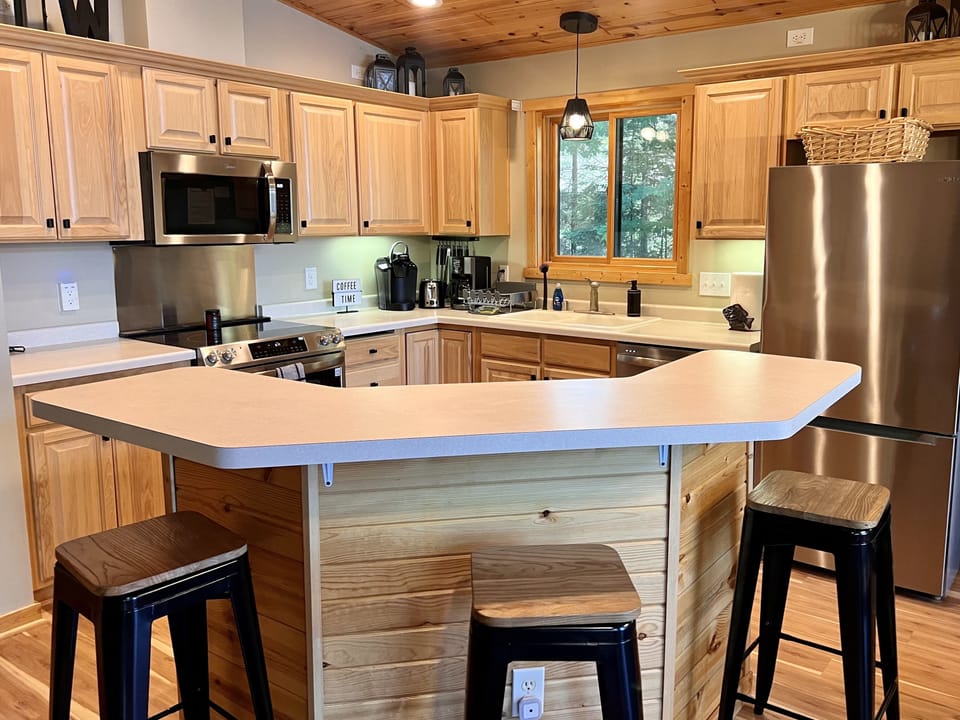 Kitchen with center island bar seating 