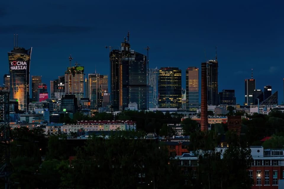Night view of the illuminated skyscrapers in the centre of Warsaw.