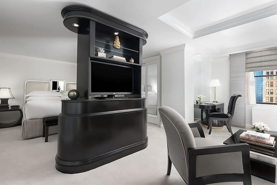Settle into a stylish suite with lounge seating and workspace.