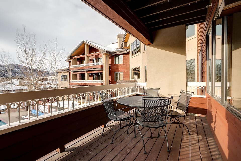 Step onto your private balcony and savor morning coffee while taking in the crisp mountain air and charming neighborhood views.