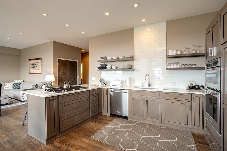 Your gourmet kitchen features premium appliances and stylish finishes, perfect for preparing meals while staying connected to your group.