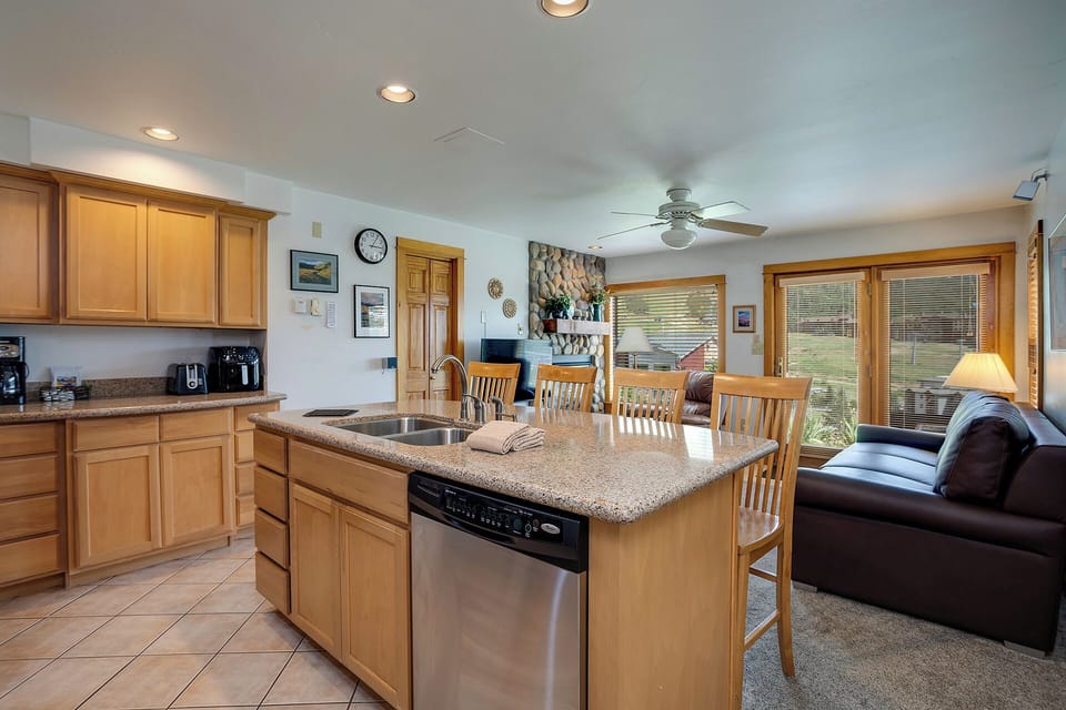 Your spacious open-concept kitchen flows beautifully into the living area, perfect for gathering with family while preparing meals together.