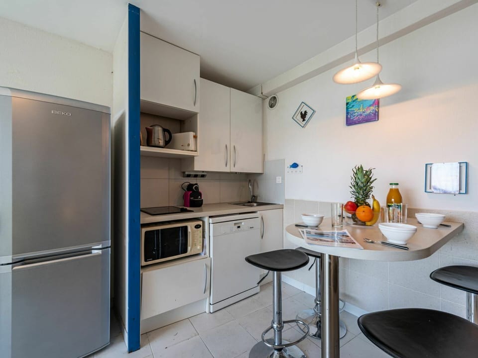 Furniture, Cabinetry, Countertop, Building, Kitchen Appliance, Kitchen, Interior Design, Kitchen Stove, Home Appliance, Table
