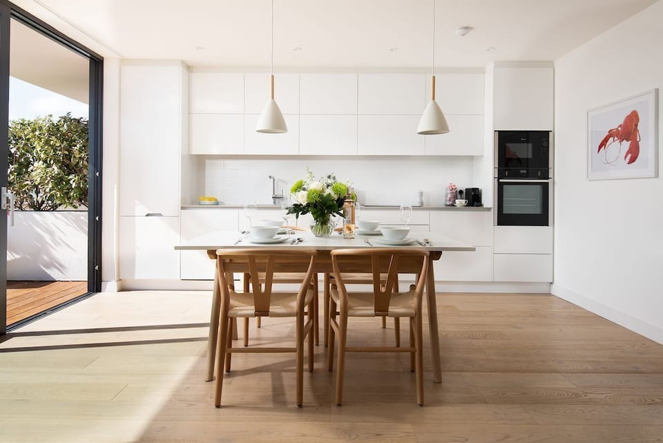 7 The Bay, Coldingham - modern pendant lighting mounted above the dining table in this contemporary living space