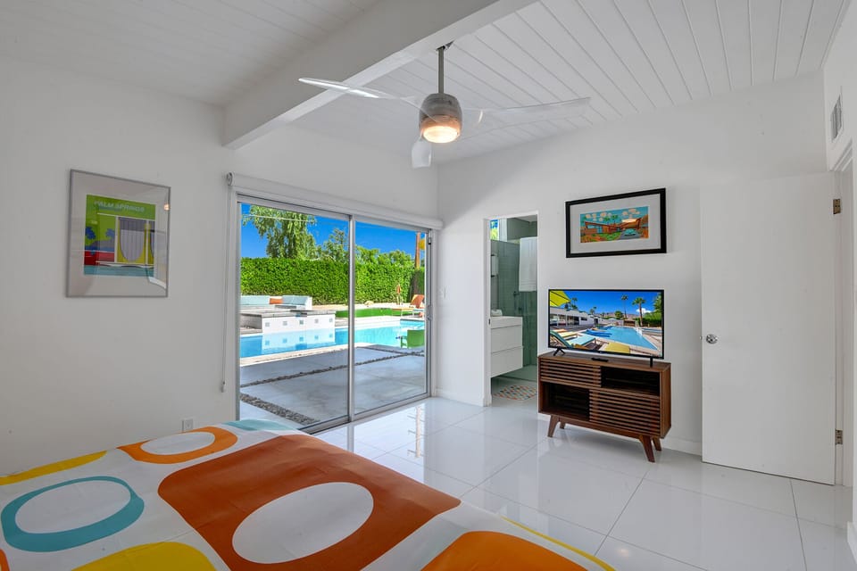 The main bedroom with view of the backyard