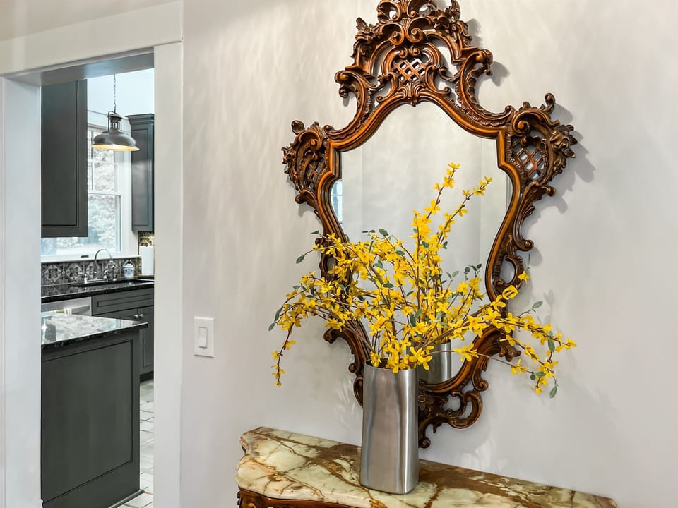 Among the home’s many treasures, the antique mirror set adds vintage charm and character.