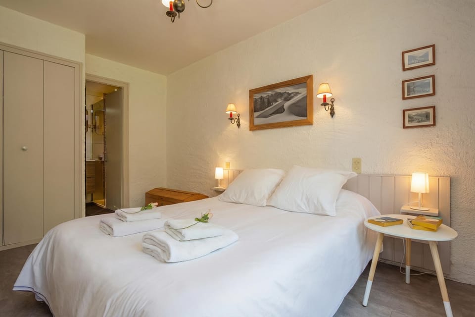 Double bed with access to the bathroom and a large cupboard