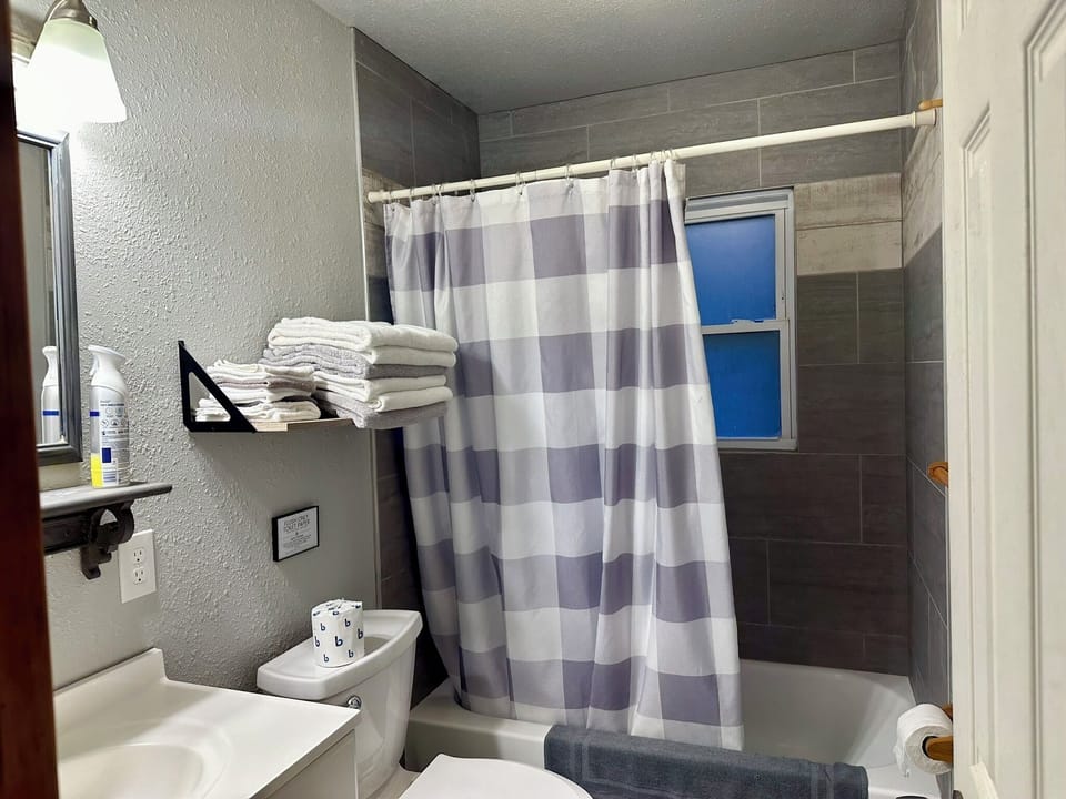 Remodeled bathroom with tub/shower surround