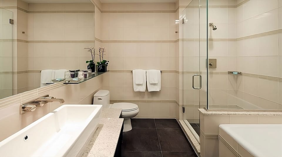 Rinse off in a glass shower with crisp, hotel-fresh towels.