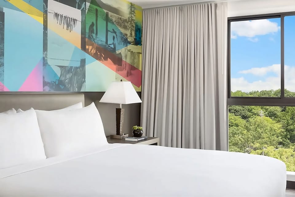 Drift off in plush bedding with calming daylight pouring in.