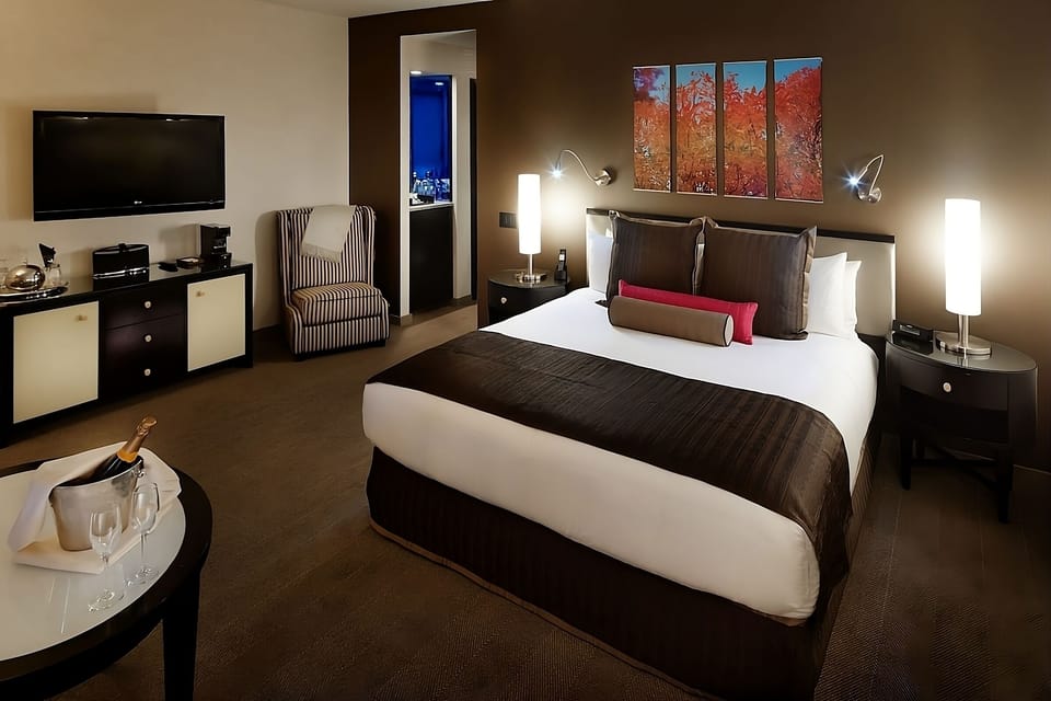 Settle in for a restful night in this spacious bedroom.