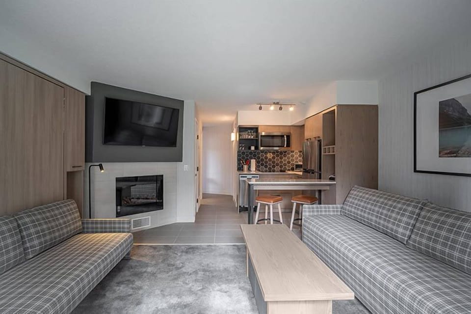 A stylish and cozy living room with warm tones and a relaxing ambiance, perfect for unwinding in comfort.