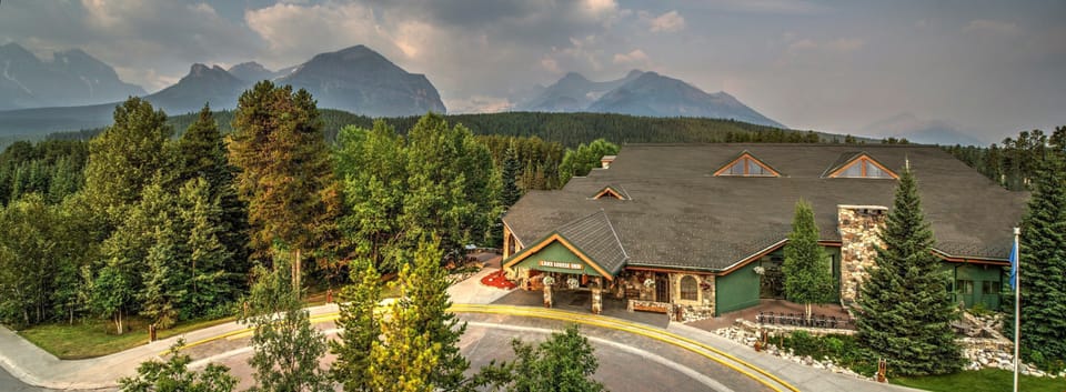 Surrounded by lush greenery and majestic mountains, this charming property offers a serene and inviting retreat.
