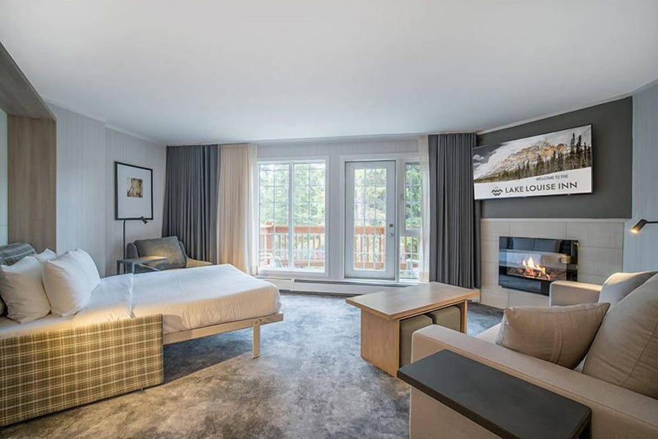 A spacious and inviting living room with cozy furnishings and a touch of natural charm, ideal for unwinding after a long day.