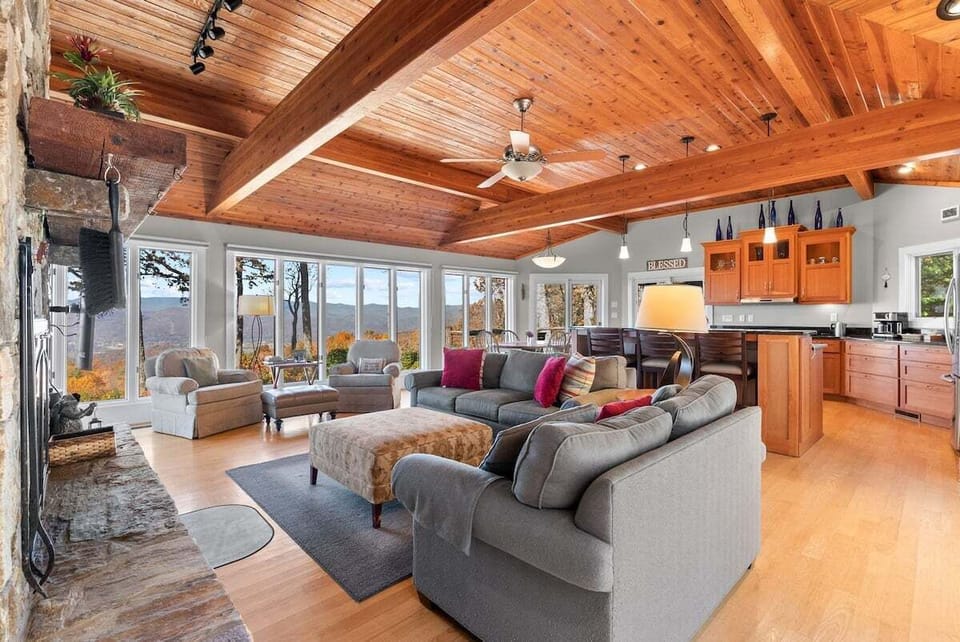 Entering the house, the kitchen is to the right and the living area is on the left with the view beyond.