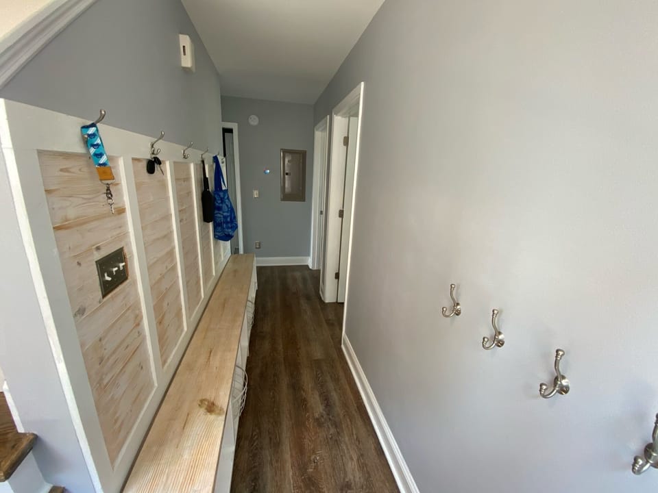 Entryway with great built-in for beach towels and flip flops!