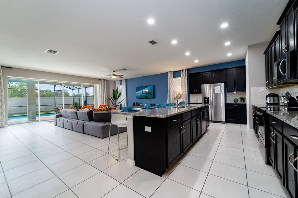 Overview of family living area showing patio doors to pool