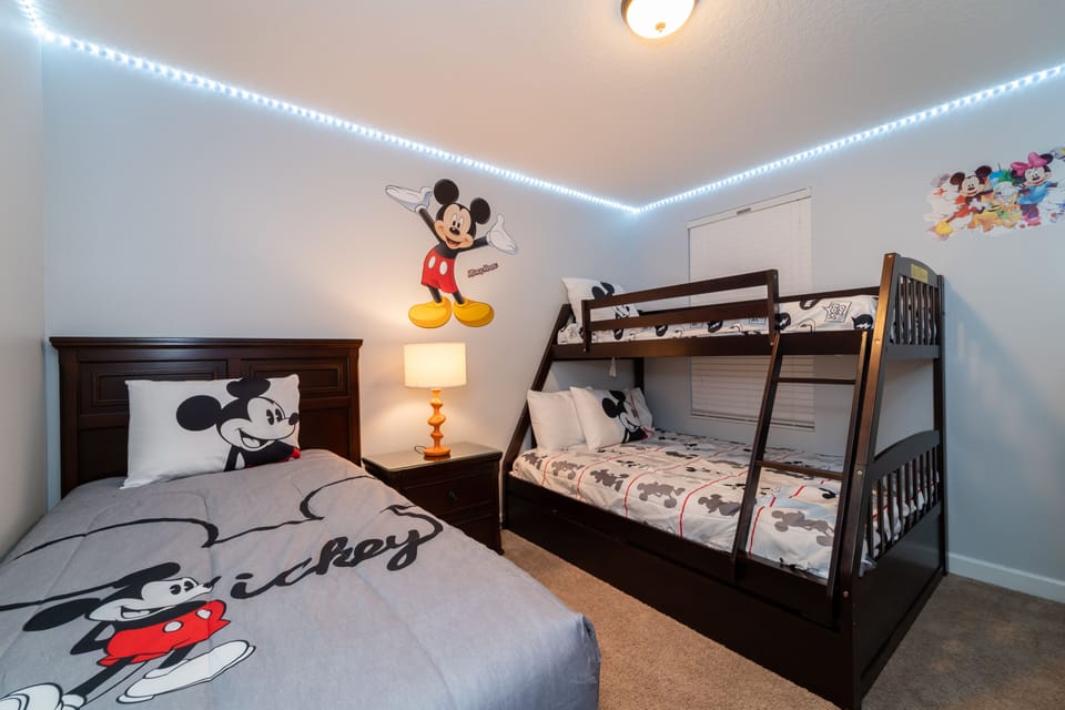 Bedroom 3 has a twin, plus bunk beds single over double with Mickey theme