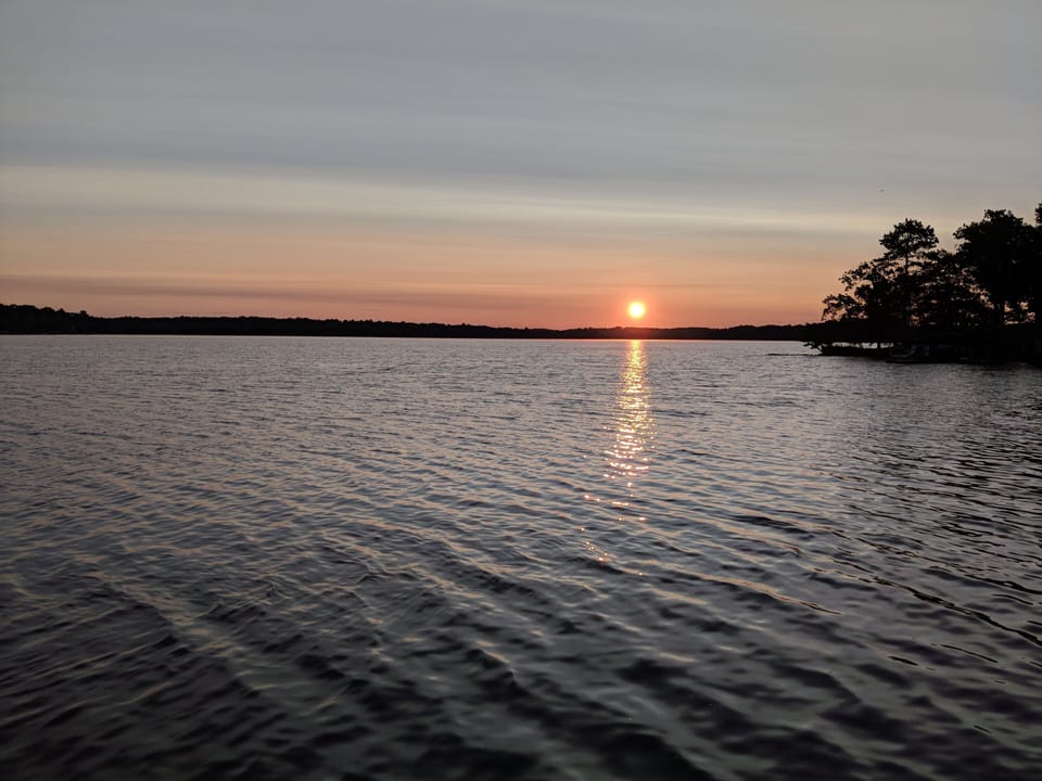 Beautiful Sun rises from the boat house