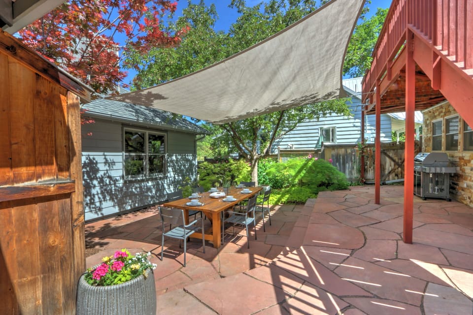 Backyard terrace with outdoor dining & sunshade