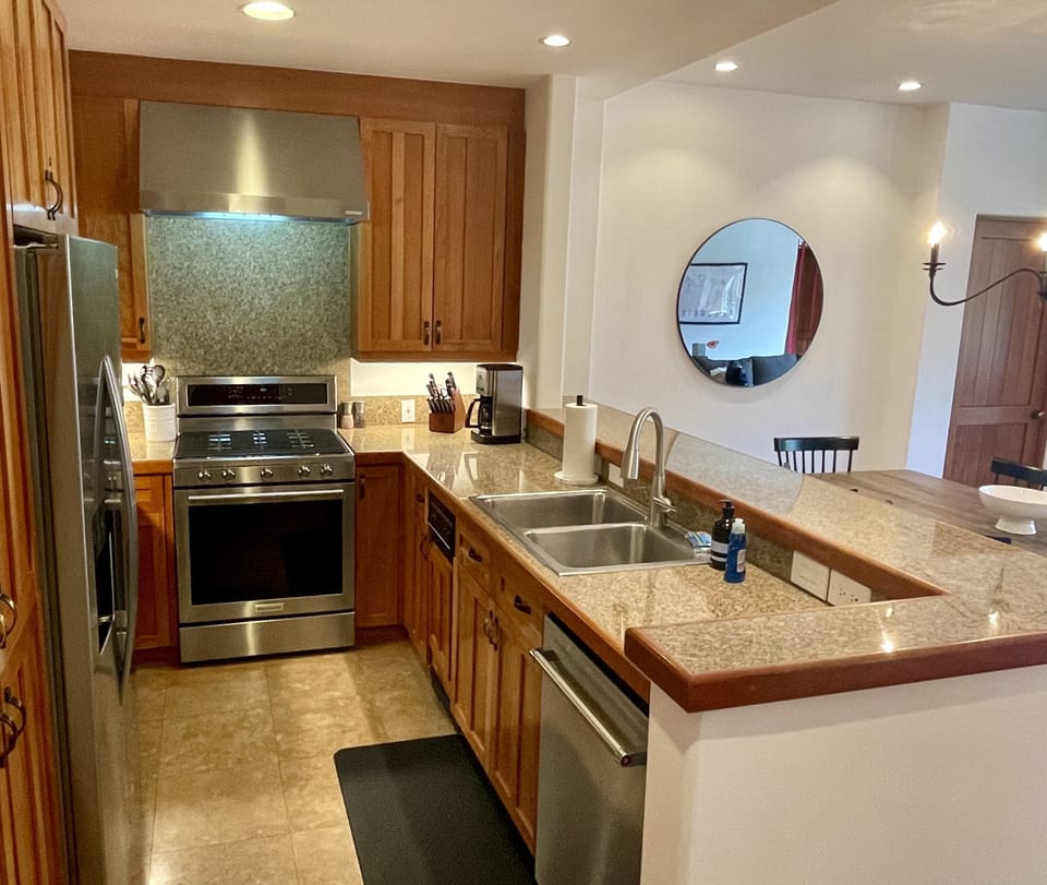 Kitchen opens to dining and living area so you don’t miss out on the action. 