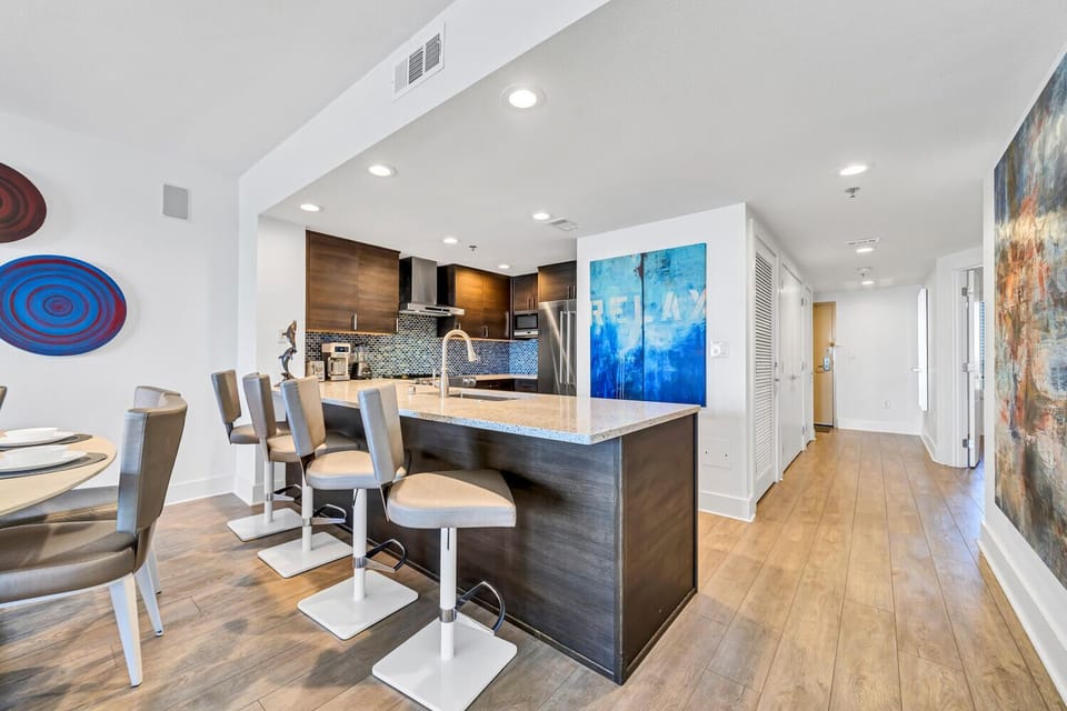 Gather around the spacious breakfast bar where mornings begin with coffee and conversation in your stylish, fully-equipped kitchen.