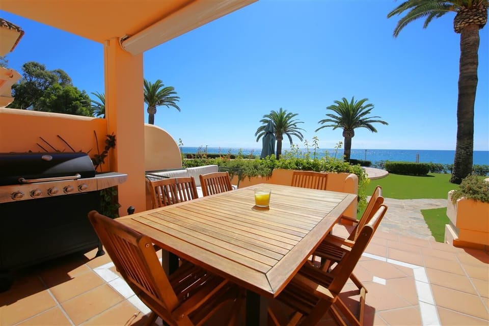 Private terrace with relaxing seating, outdoor dining area and gas barbecue