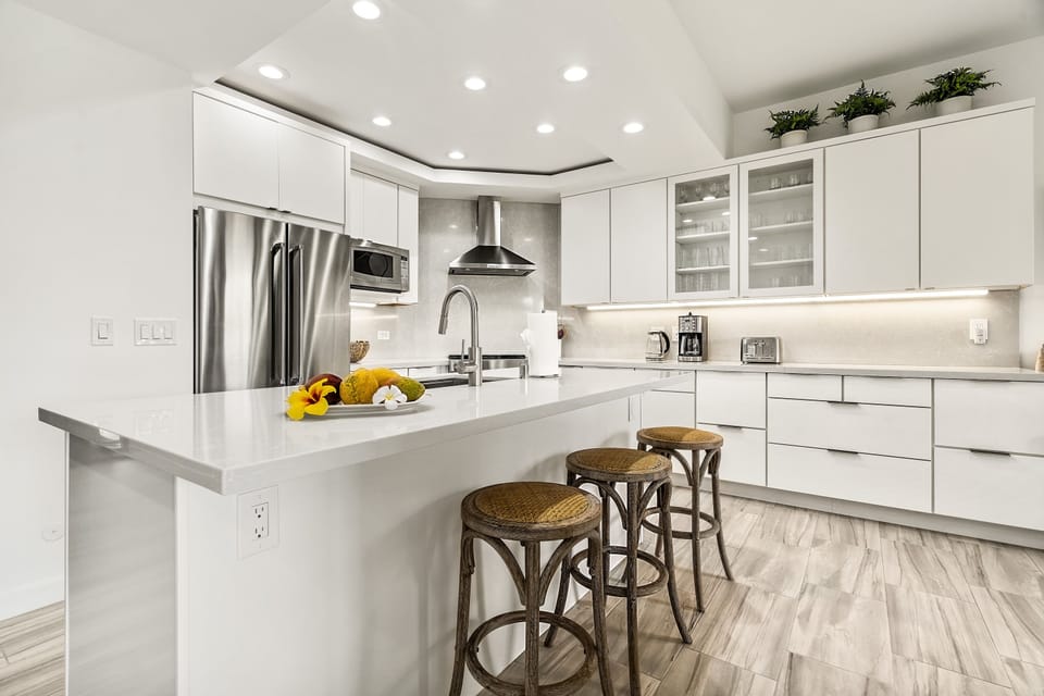 Kitchen with Island, Refrigerator, Microwave, and Coffee Maker