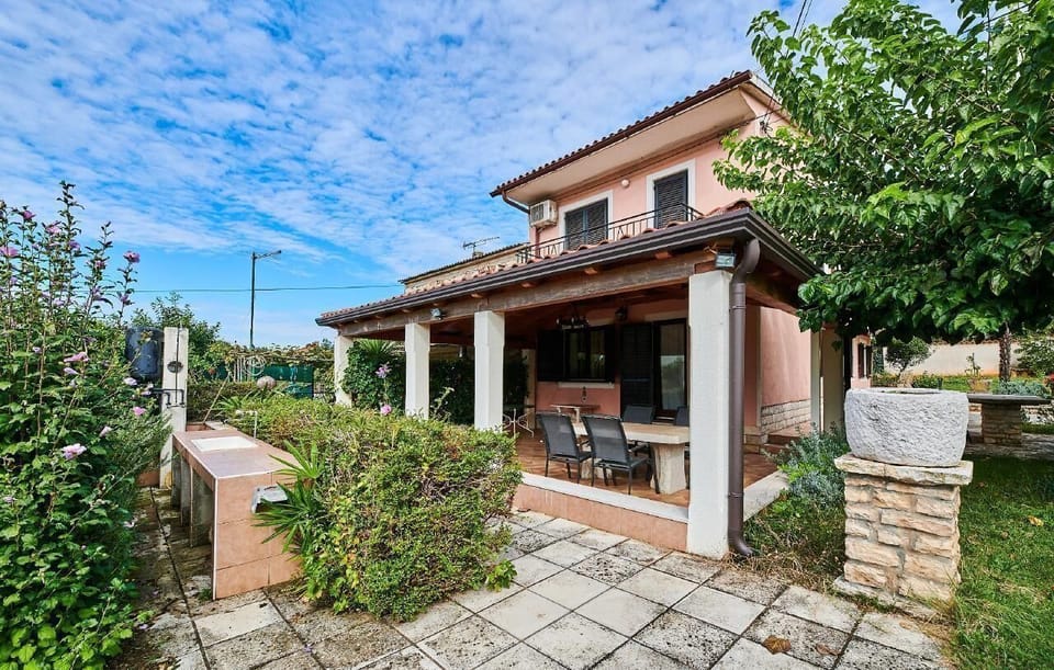 The garden of the house with outdoor shower, terrace