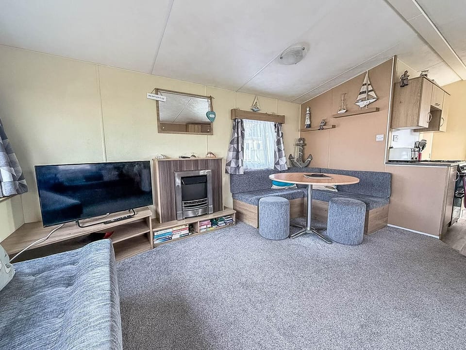 Situated conveniently opposite the kitchen, this dining booth is the ideal spot for sharing meals, playing board games, or simply planning your next day's adventure on the Norfolk coast.