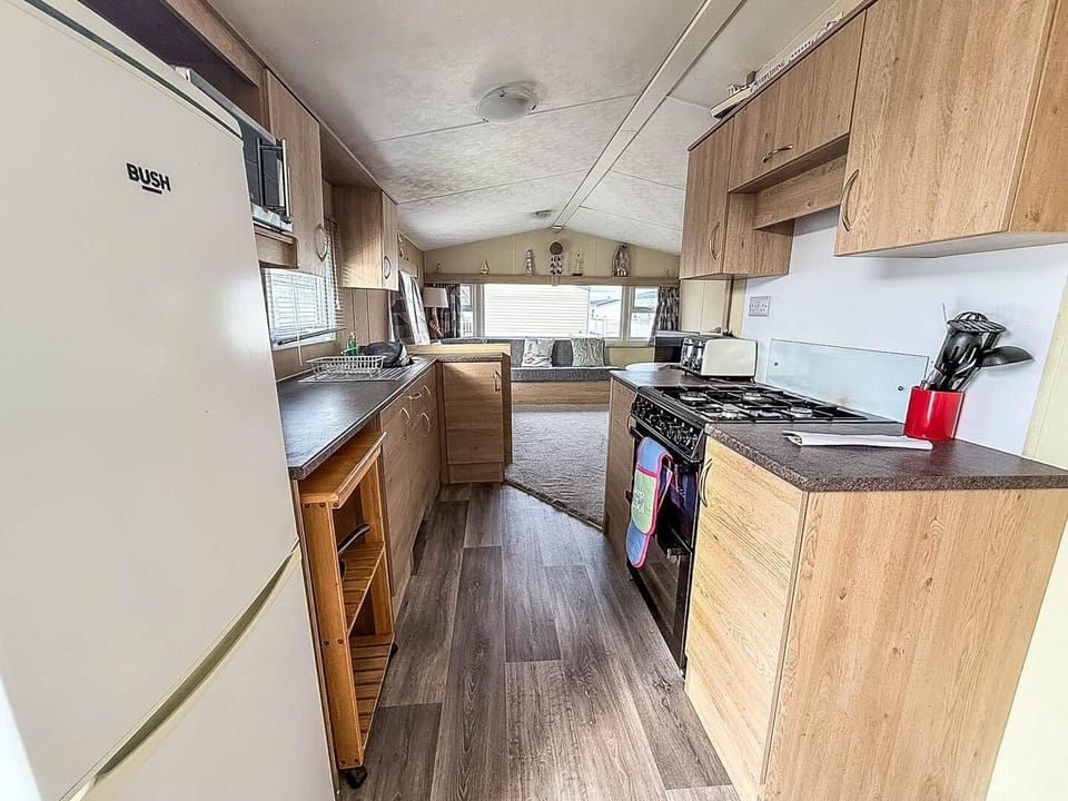 Prepare your favourite holiday meals while being part of the conversation in this convenient open plan caravan kitchen.