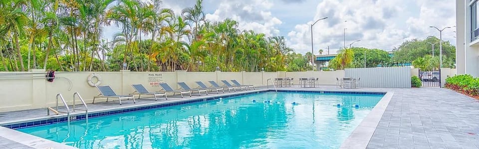 Dive into the sparkling pool and lounge in the sun.