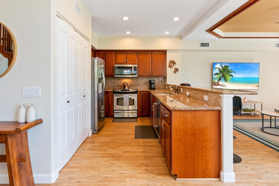 Fully equipped kitchen with granite counters and stainless steel appliances