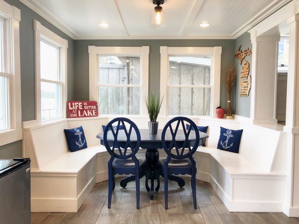 The kitchen includes custom built dining with lake views and an extra fridge!