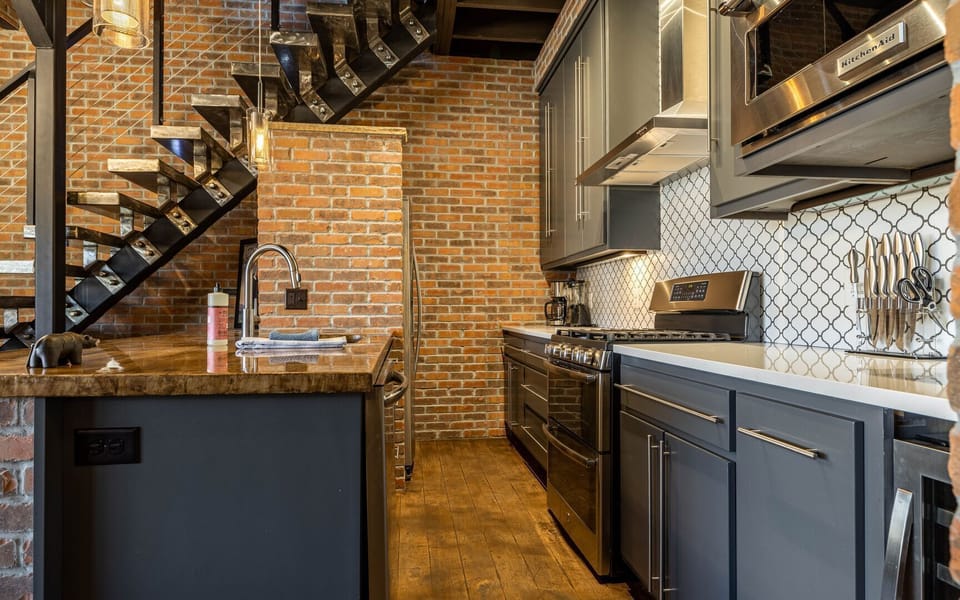 The chef's kitchen with modern appliances and wine fridge is great for entertaining