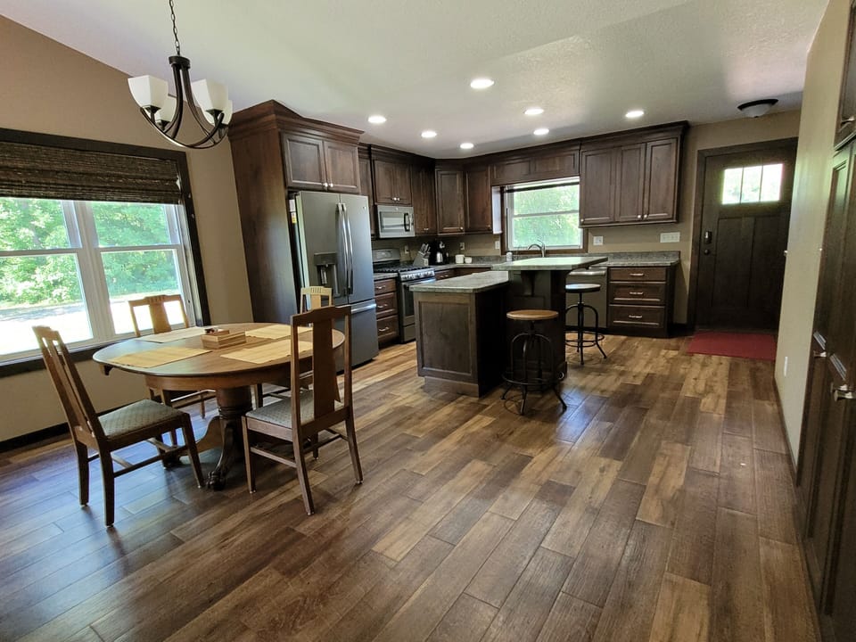 Kitchen view with old dining table. 