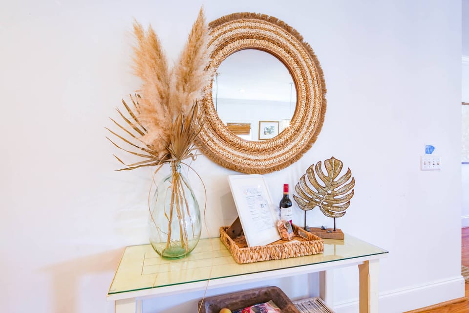 The two bedrooms on the first floor are located down the hall from the kitchen and dining area.