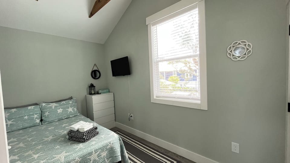 Full sized bed with views of pool/yard