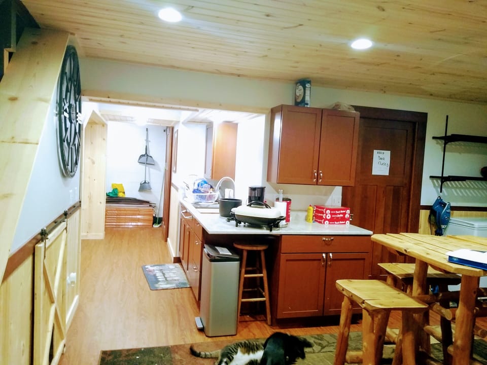 Hallway kitchen.  Bathroom to the right